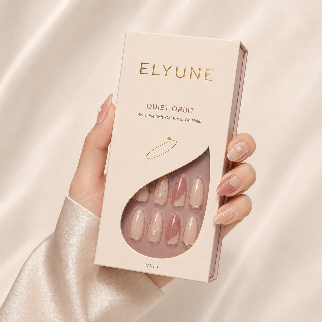 Soft-gel press-ons with delicate pearl and champagne orbit details.